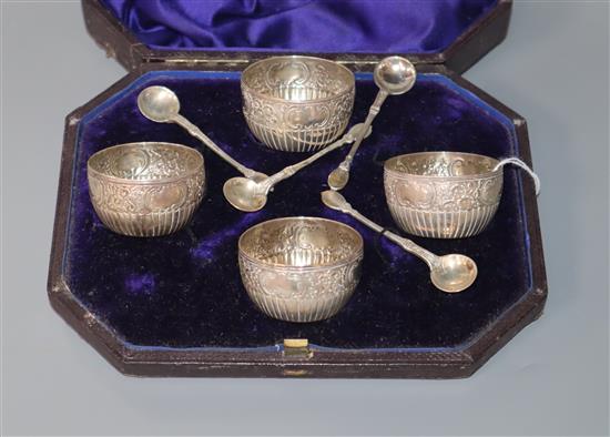 A cased set of four Victorian silver salts and matching spoons, Charles Edwards, London, 1878.